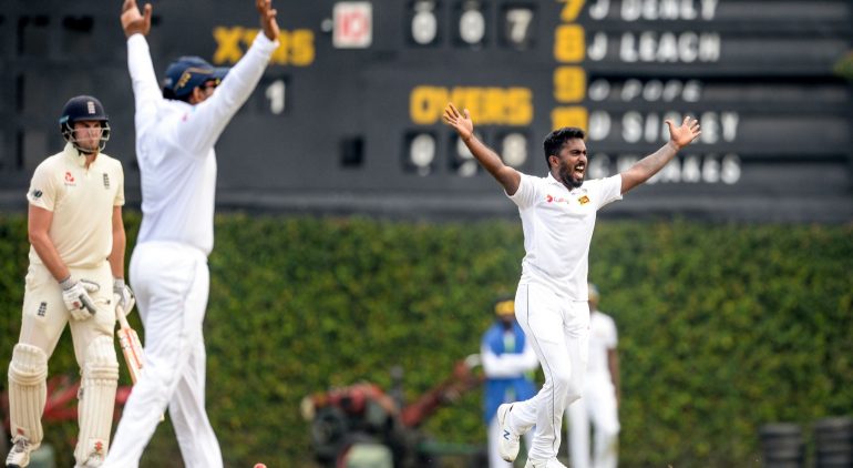 Sri Lanka Board President's XI Avishka Fernando (R) unsuccessfully appeals for a Leg Before Wicket (LBW) decision against England's Dom Sibley (L) during the opening day of a four-day practice match between Sri Lanka Board President's XI and England at the P. Sara Oval Cricket Stadium in Colombo on March 12, 2020. - England will play two test matches against Sri Lanka during their tour of Sri Lanka under the ICC World Test Championship. (Photo by LAKRUWAN WANNIARACHCHI / AFP) (Photo by LAKRUWAN WANNIARACHCHI/AFP via Getty Images)