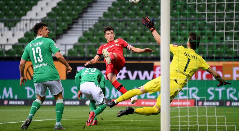 BREMEN, GERMANY - MAY 18: Kai Havertz (C) of Leverkusen scores the opening goal during the Bundesliga match between SV Werder Bremen and Bayer 04 Leverkusen at Wohninvest Weserstadion on May 18, 2020 in Bremen, Germany. The Bundesliga and Second Bundesliga is the first professional league to resume the season after the nationwide lockdown due to the ongoing Coronavirus (COVID-19) pandemic. All matches until the end of the season will be played behind closed doors. (Photo by Stuart Franklin/Getty Images)
