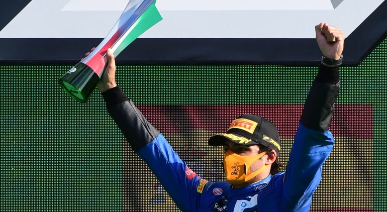 Second placed McLaren's Spanish driver Carlos Sainz Jr celebrates on the podium after the Italian Formula One Grand Prix at the Autodromo Nazionale circuit in Monza on September 6, 2020. (Photo by JENNIFER LORENZINI / POOL / AFP) (Photo by JENNIFER LORENZINI/POOL/AFP via Getty Images)