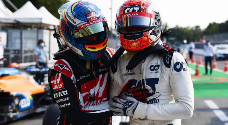 MONZA, ITALY - SEPTEMBER 06: Race winner Pierre Gasly of France and Scuderia AlphaTauri celebrates with Romain Grosjean of France and Haas F1 in parc ferme during the F1 Grand Prix of Italy at Autodromo di Monza on September 06, 2020 in Monza, Italy. (Photo by Miguel Medina - Pool/Getty Images)